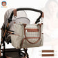 sac à langer accroché à la poussette avec ses attaches poussette