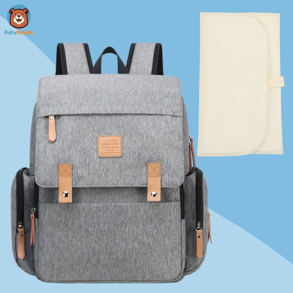sac à langer à dos gris avec tapis à langer