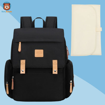 sac à dos à langer noir avec tapis à langer beige