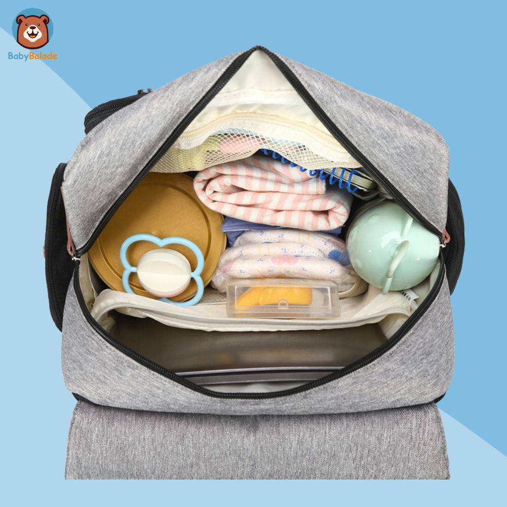 sac à dos à langer gris - contenu